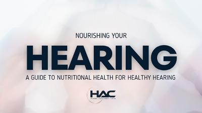 Text reads, Nourishing Your Hearing: A Guide to Nutritional Health for Healthy Hearing. The logo HAC Hearing Assessment Center appears at the bottom. The background is light with a faint image behind the text.